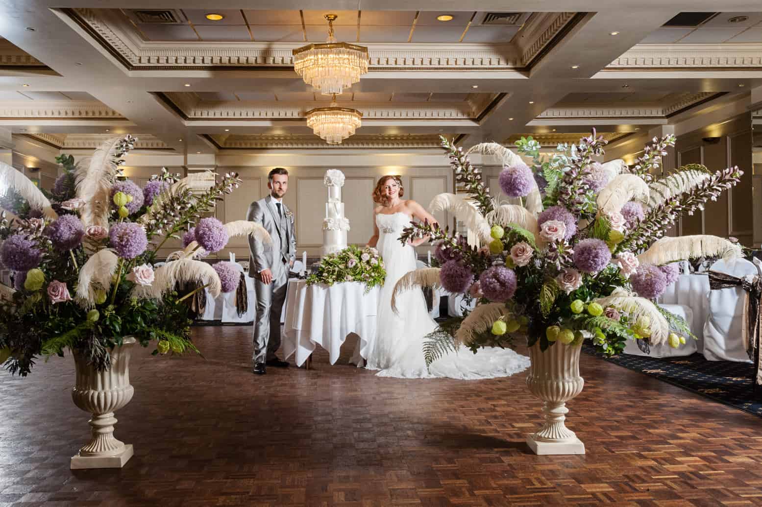 Wedding couple and flowers in the Duke of Cornwall's ballroom