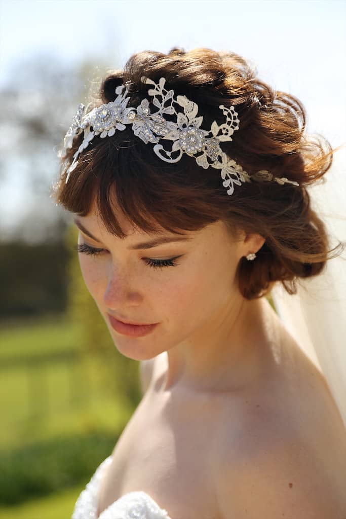 Bride wearing headband with flower and leaf detail