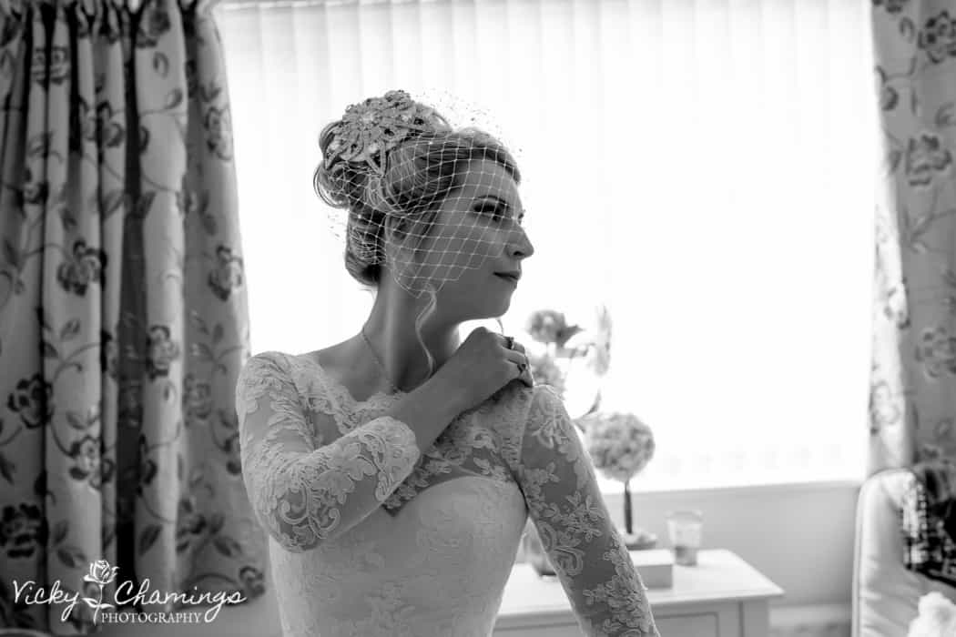 Black and white photo of a bride wearing elaborate headwear
