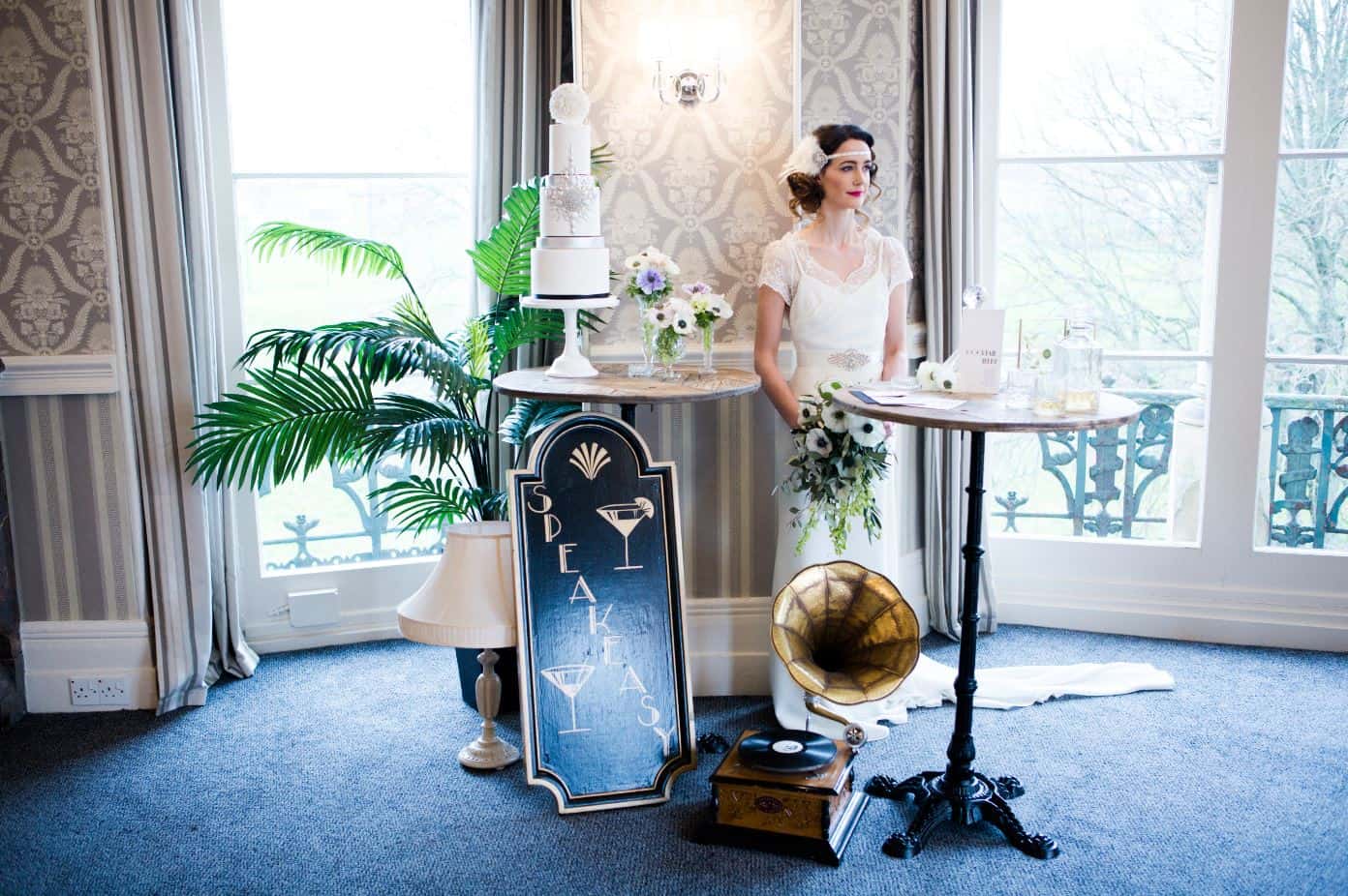 Bride with 1920s inspired gramophone and signage wedding props